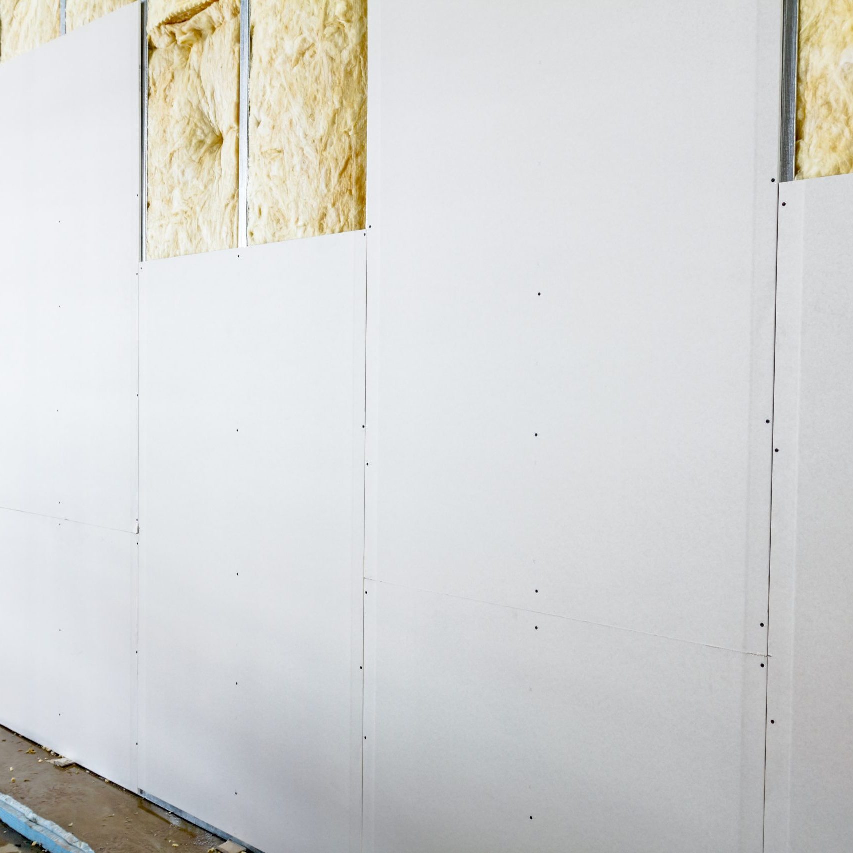 View at unfinished thermal partition dry wall with mineral wool.